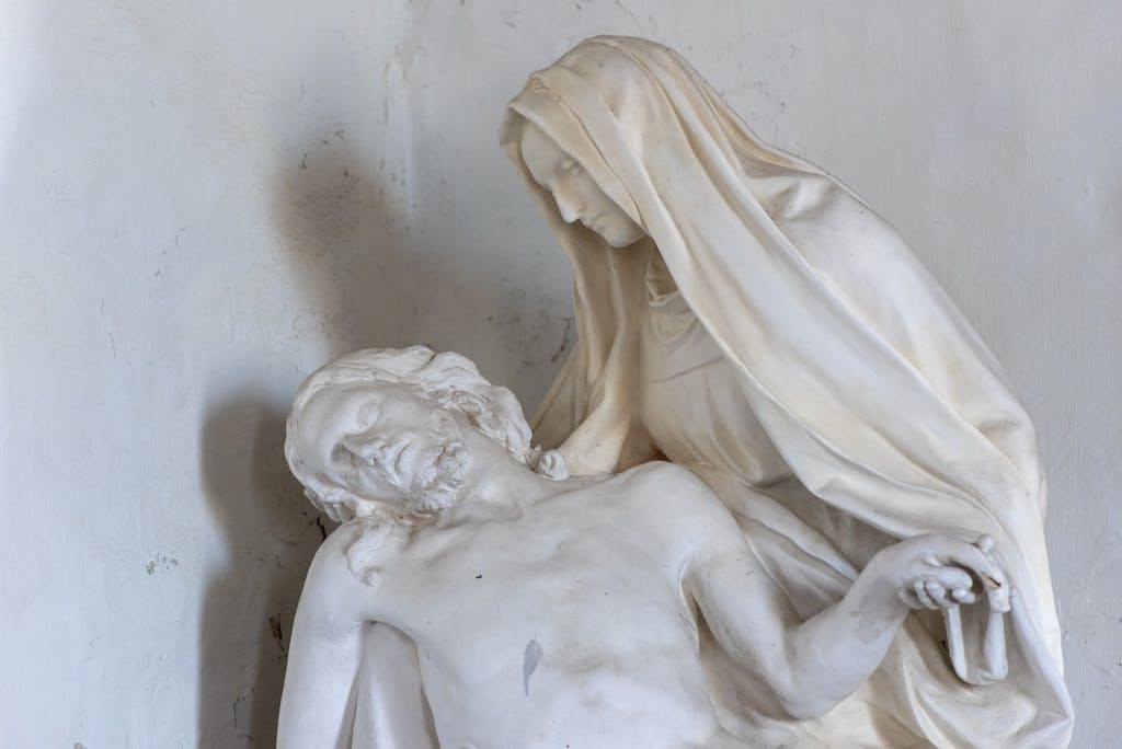 Elegant sculpture depicting Mary cradling Jesus, evoking serenity and artistry.